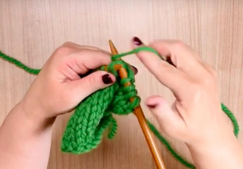bring yarn around right needle to knit