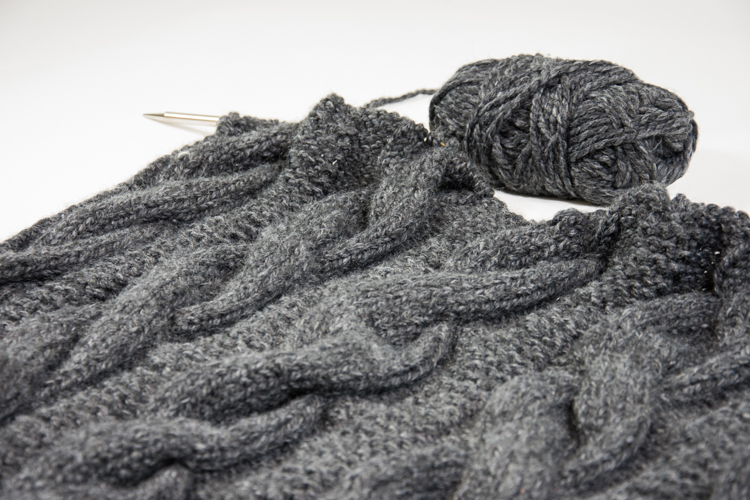 Close up of knitted cable blanket WIP