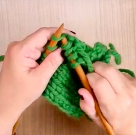 slip the first stitch off left needle then the second
