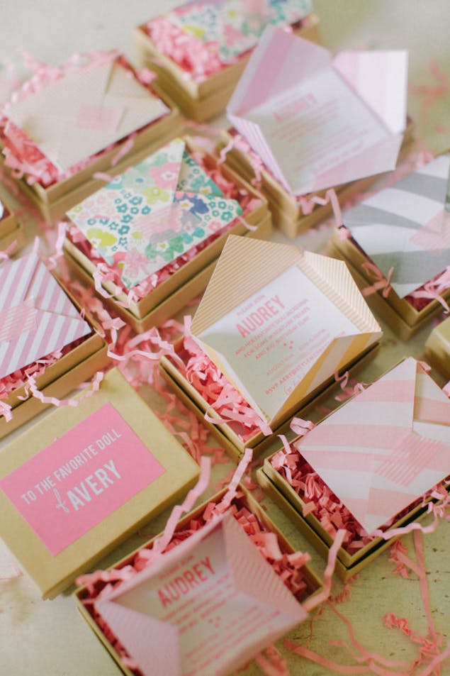 origami pink and brown paper boxes with invitation letter and tissue paper inside