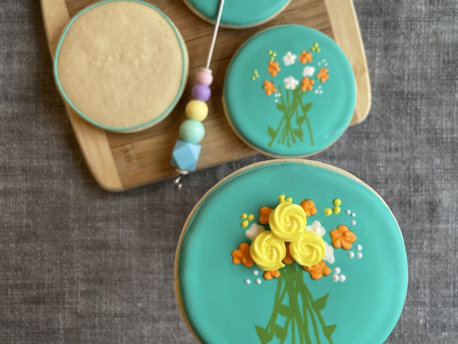 Learn how to ice your sugar cookies using royal icing with these fabulous floral designs