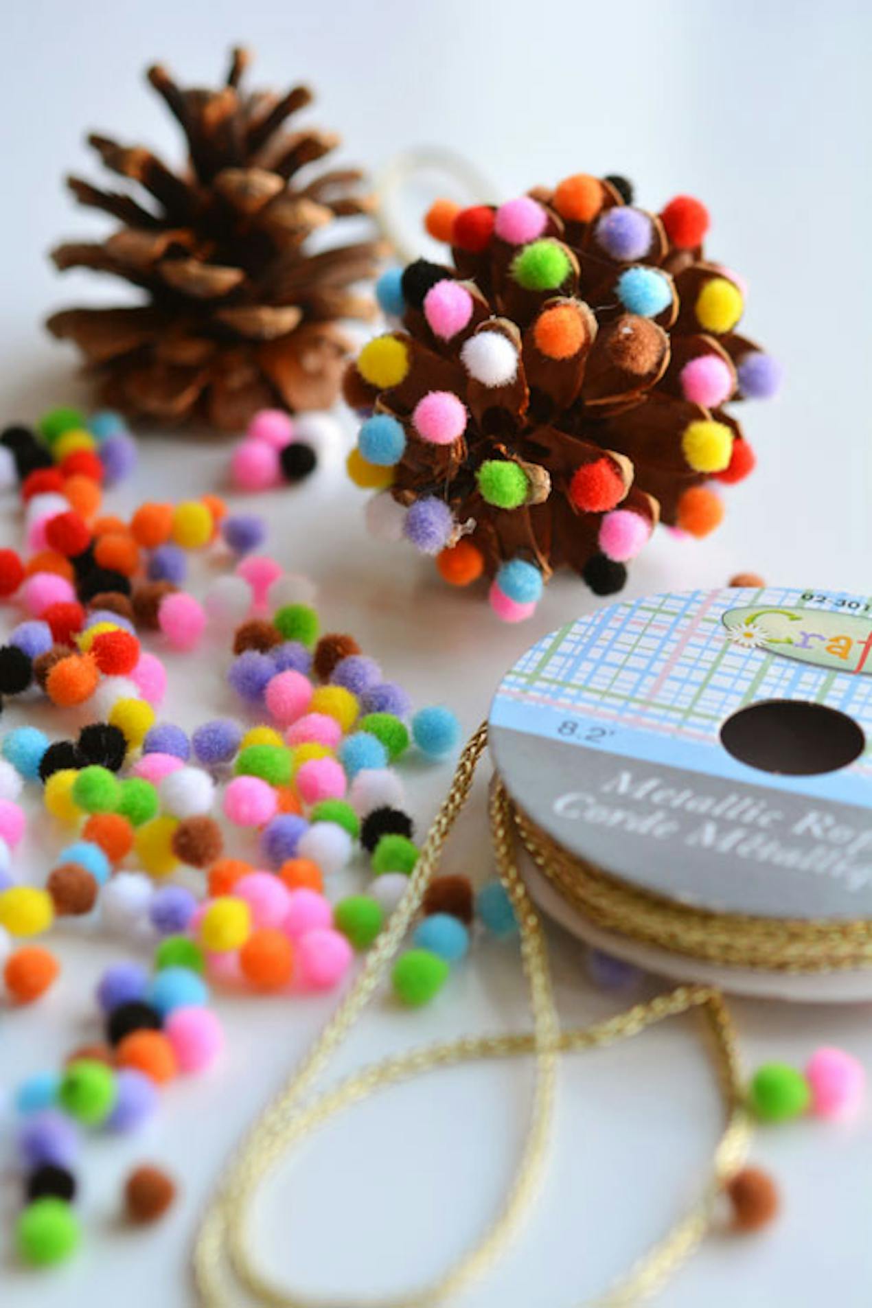 Pine cone bobble Christmas Kids craft by One Little Project