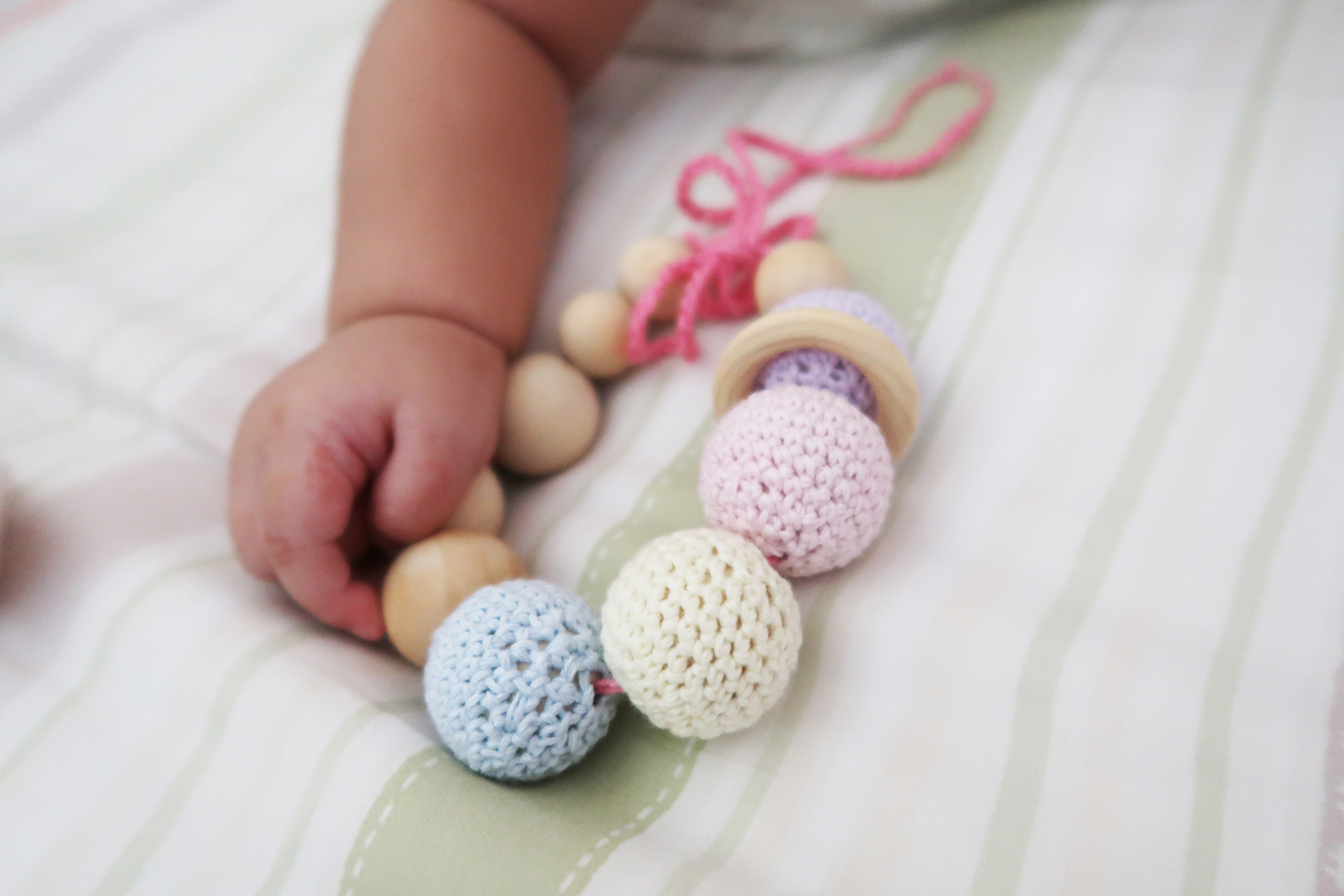 Baby play with crochet teething bracelet