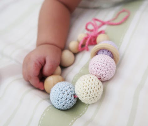 Baby play with crochet teething bracelet