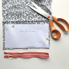 paper pattern pinned to fabric