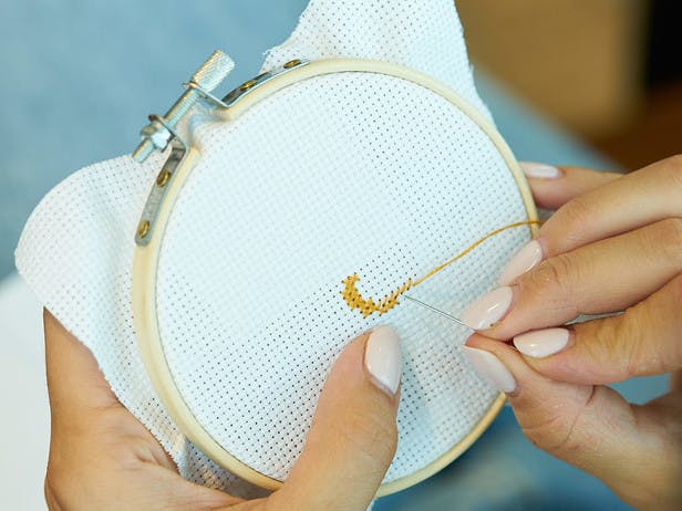 embroidery hoop with needle and thread