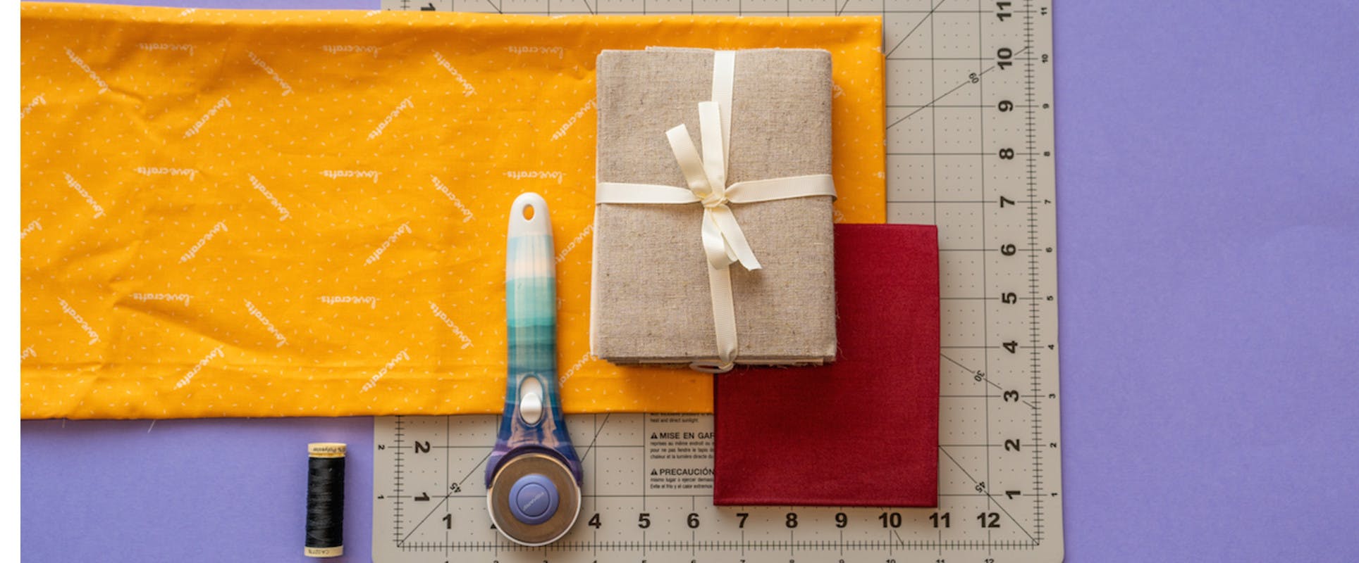 quilting supplies, quilting precut fabric and rotary cutter and measuring board