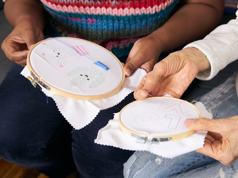 two people doing embroidery together 