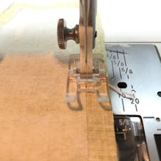Sewing machine foot on the fabric