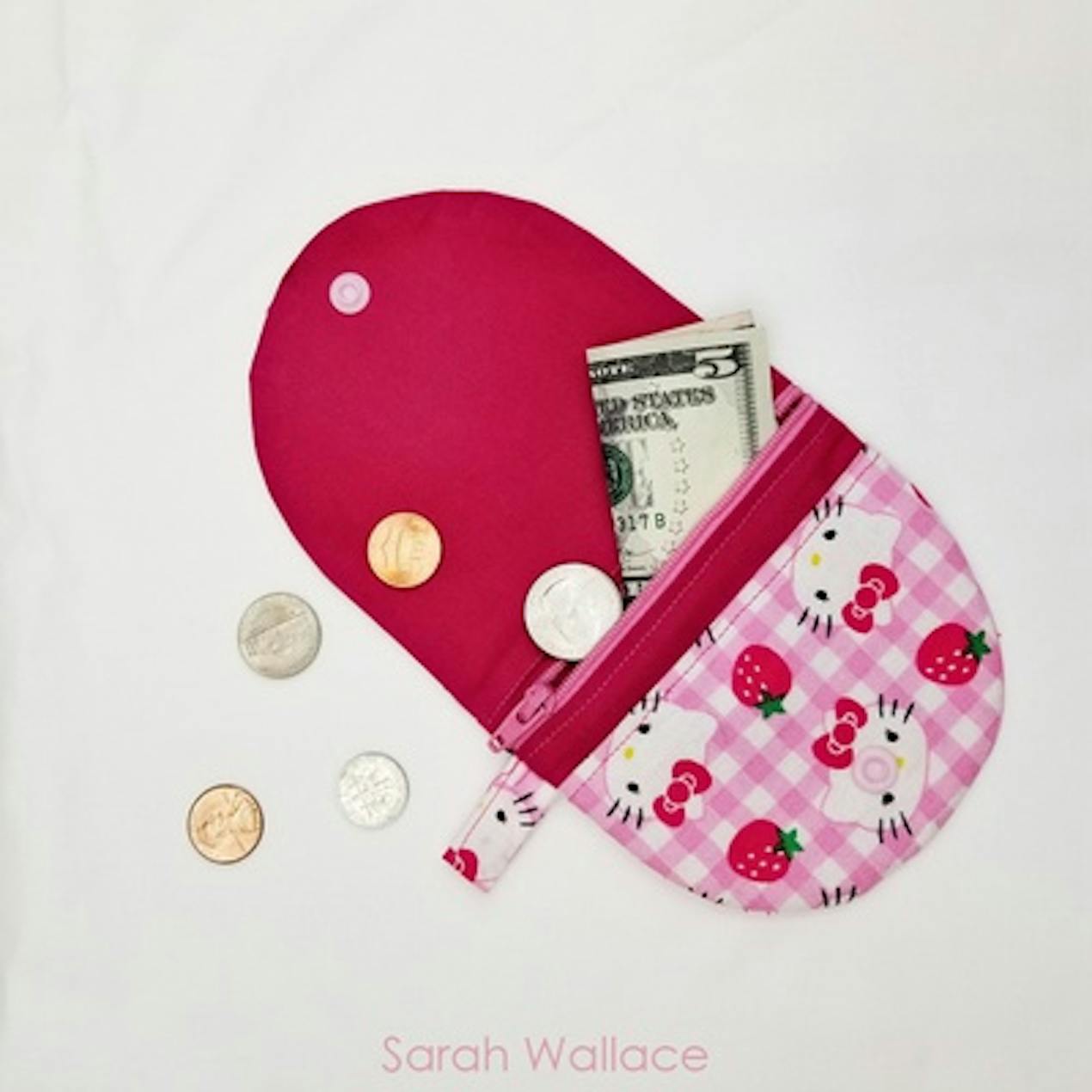 sewn coin purse with zip compartment, lined with plastic popper close