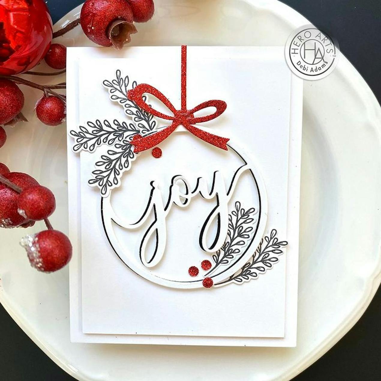 die cut bauble card design with joy cut out in the centre