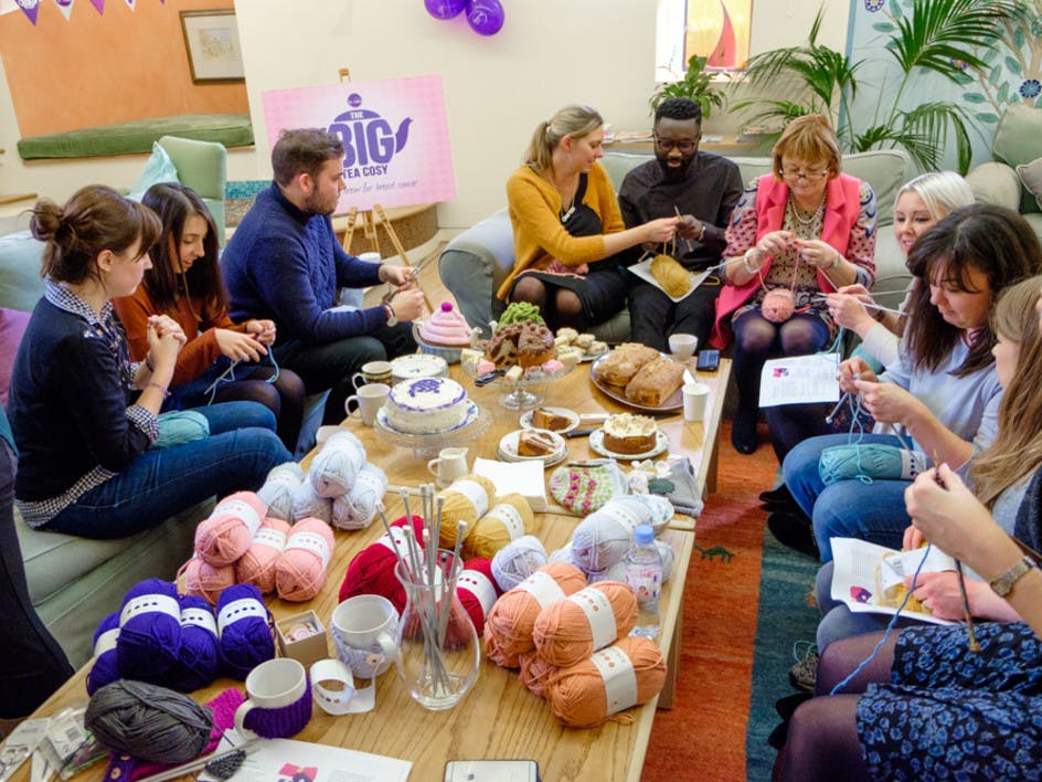 group of friends knitting together