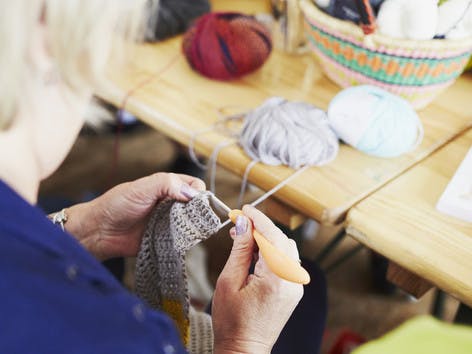 Close up to woman's hands crocheting