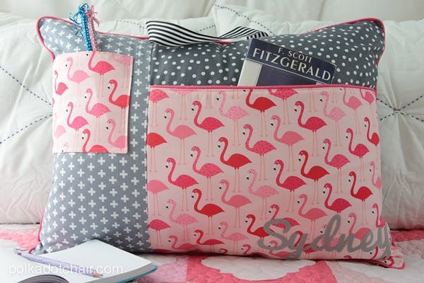 a study pillow with book pocket, ribbon handle and pencil holder