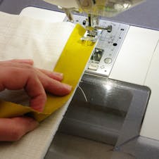 binding the quilt with a sewing machine