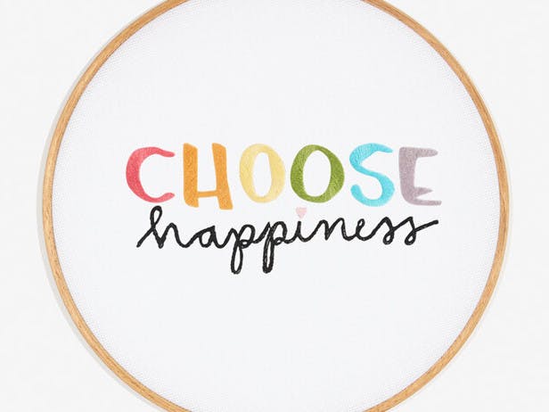 "Choose Happiness" embroidered lettering in a embroidery hoop