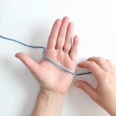 layout your yarn to start over your palm