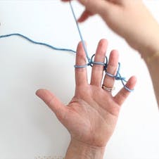 move the tail yarn between your fingers